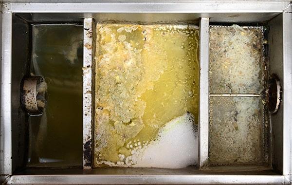 neglecting grease interceptor cleaning can lead to foul odors, backed-up plumbing, and expensive repairs in the kitchen